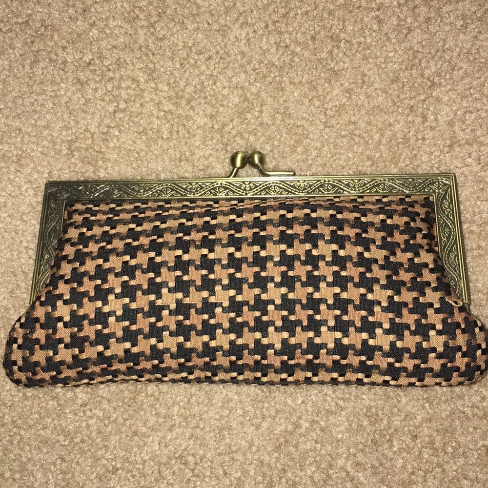 Prezzo brown and black clutch.